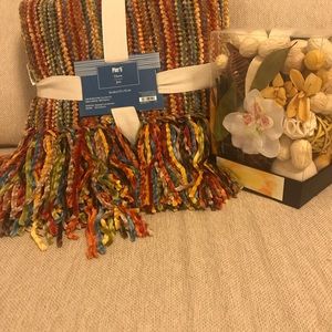 Multi colored throw and potpourri